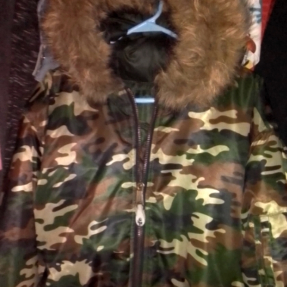Reversible Puffer Comouflage fur hooded jacket.